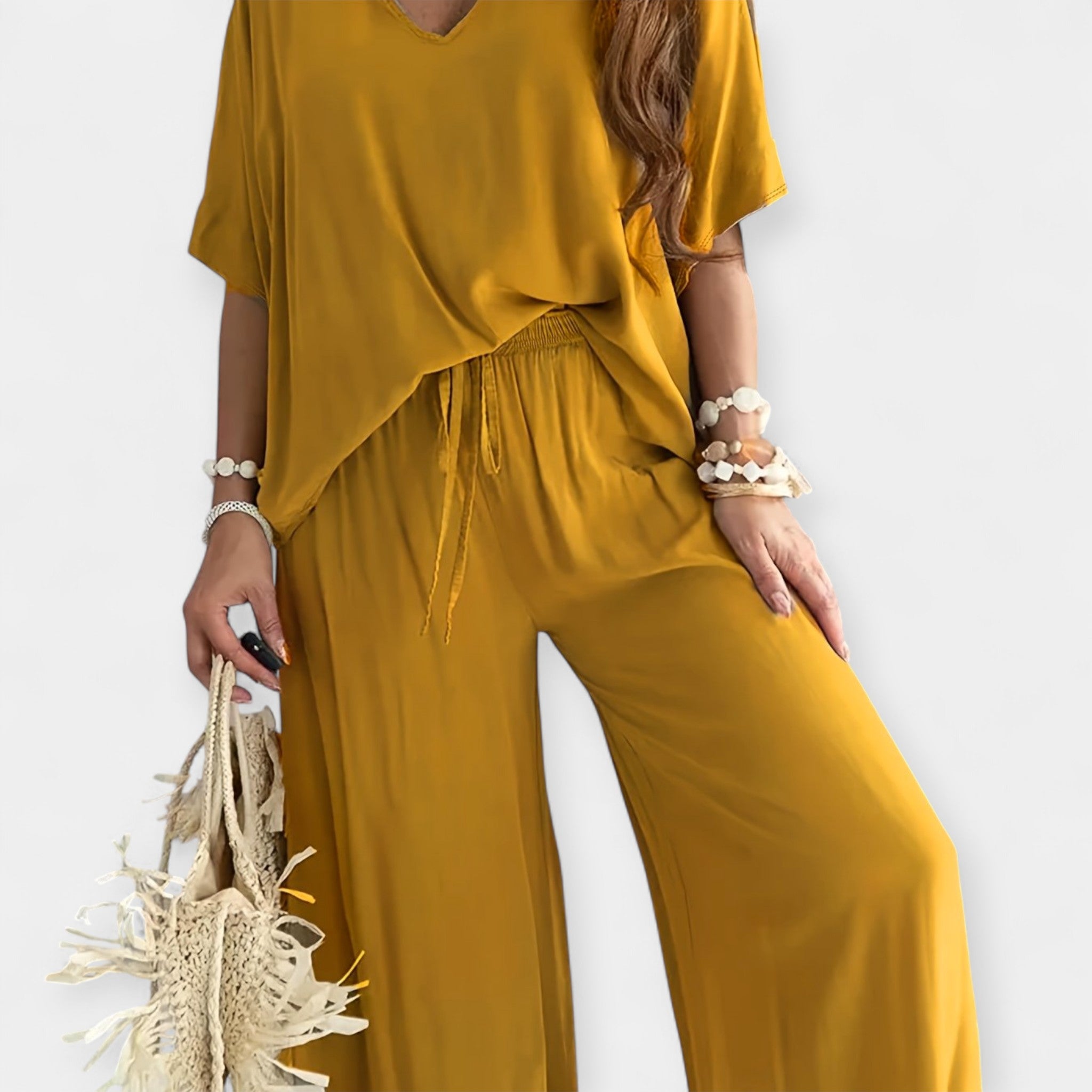 Set lejer cu pantaloni evazați și bluză